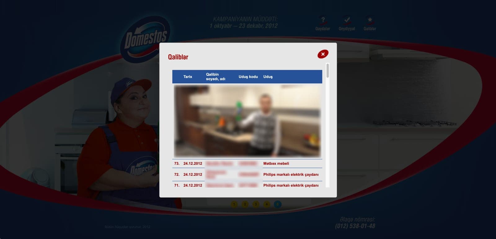 The winners window: a table of date, winner, prize code and prize — kitchen furniture, Philips electric kettles — under a photo of a winner; the photo, names and codes are blurred.